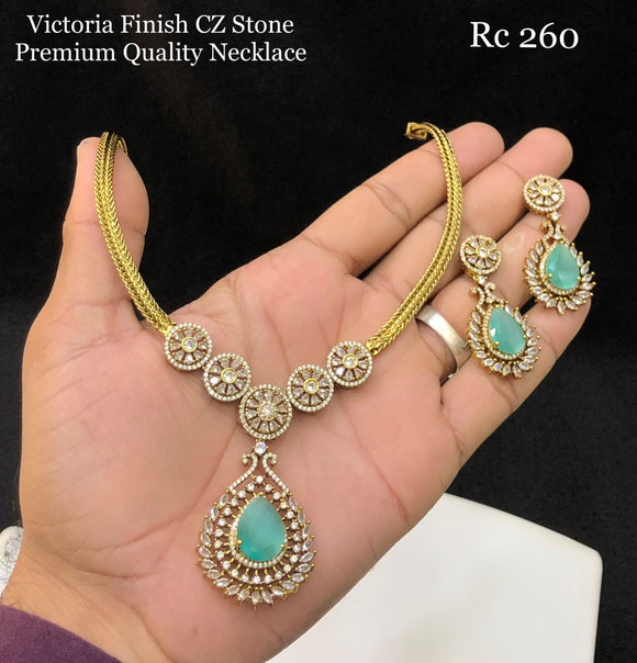 Rajani , elegant Gold Finish Pastel Green stone pendant necklace set for women -SHAKI001PGN